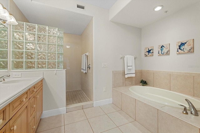 full bathroom featuring visible vents, tile patterned floors, a garden tub, vanity, and a walk in shower
