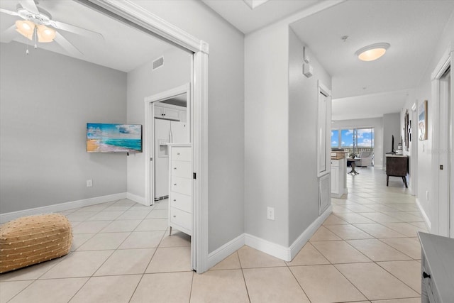 147 Tampa Ave E Unit 702, Venice, FL 34285 - hallway with light tile patterned floors and baseboards