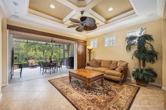 living room with light tile patterned floors, baseboards, coffered ceiling, ceiling fan, and crown molding