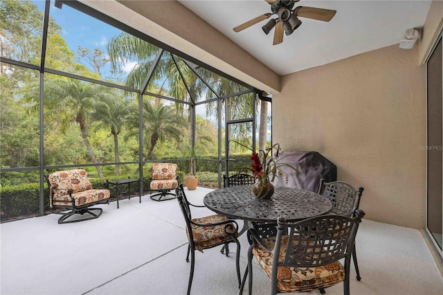 sunroom / solarium featuring ceiling fan