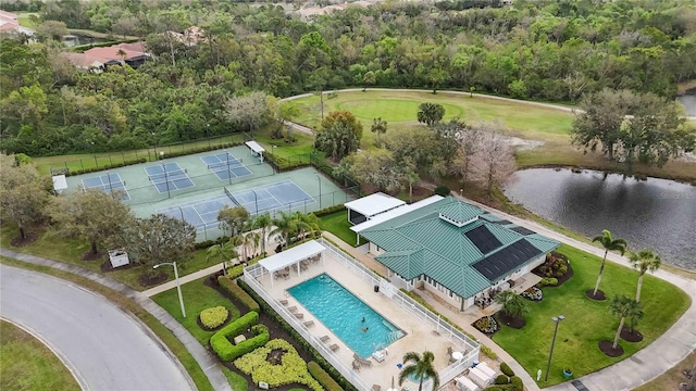 birds eye view of property with a water view