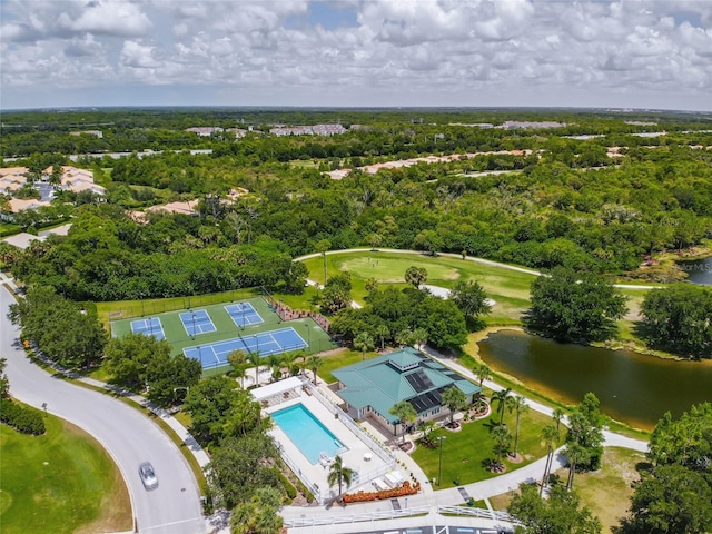 birds eye view of property featuring a water view and a view of trees