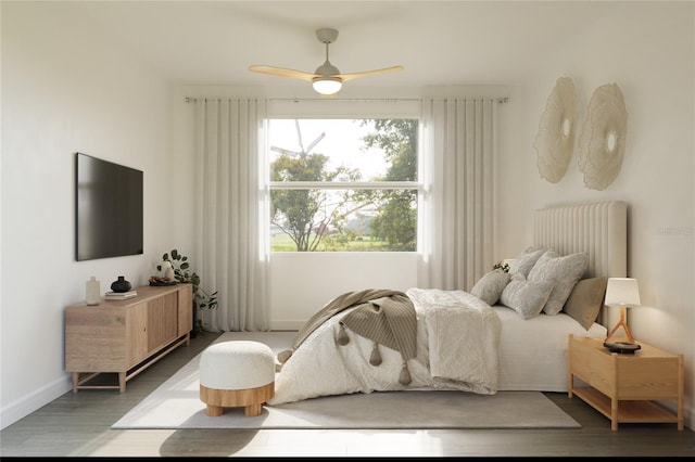 bedroom with hardwood / wood-style floors and ceiling fan