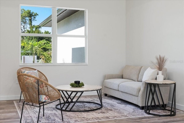 18290 Grace Ave, Port Charlotte, FL 33948 - sitting room featuring wood finished floors and baseboards