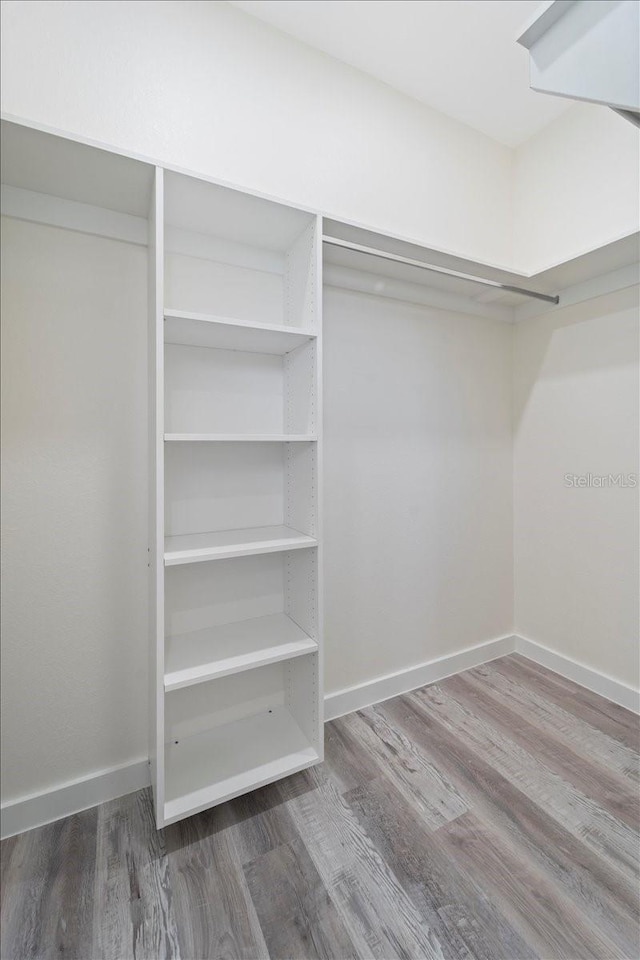 18290 Grace Ave, Port Charlotte, FL 33948 - spacious closet featuring wood finished floors