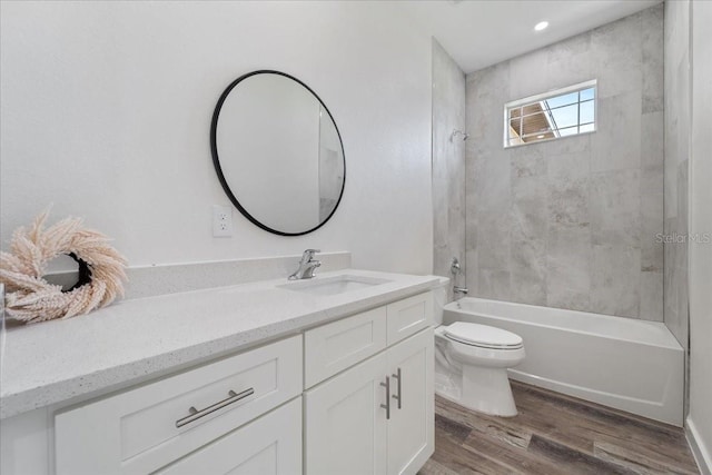 18290 Grace Ave, Port Charlotte, FL 33948 - full bathroom with vanity, wood finished floors, and bathtub / shower combination