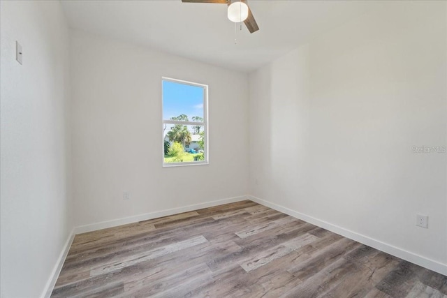 18290 Grace Ave, Port Charlotte, FL 33948 - unfurnished room with wood finished floors and a ceiling fan