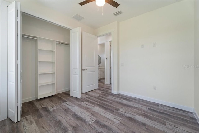 18290 Grace Ave, Port Charlotte, FL 33948 - unfurnished bedroom with wood finished floors, a closet, and a ceiling fan