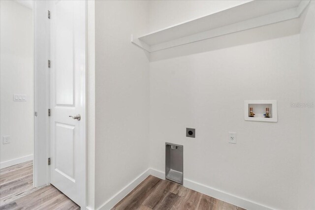 18290 Grace Ave, Port Charlotte, FL 33948 - washroom with electric dryer hookup, wood finished floors, and hookup for a washing machine