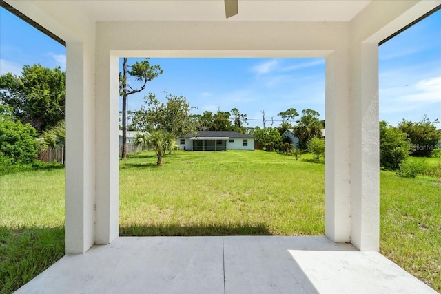 18290 Grace Ave, Port Charlotte, FL 33948 - view of green lawn with a patio area