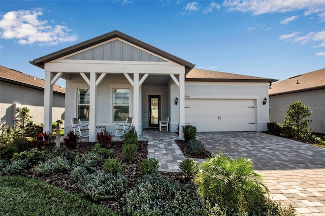 view of front of home with a garage and covered porch