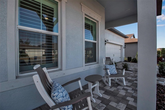 view of patio featuring a garage