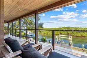 interior space with a water view and wooden ceiling