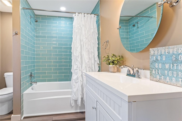 full bathroom with shower / bath combination with curtain, vanity, and toilet