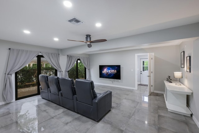 cinema room featuring ceiling fan