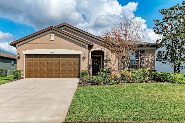 view of front facade with a garage and a front lawn