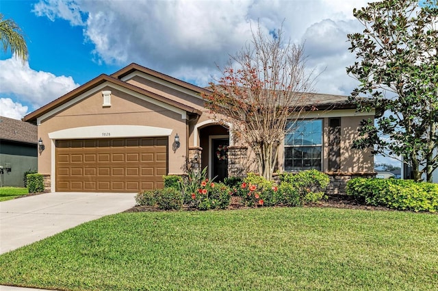 view of front of property featuring a garage and a front yard