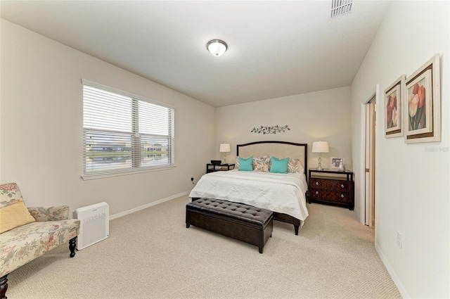 bedroom featuring light carpet