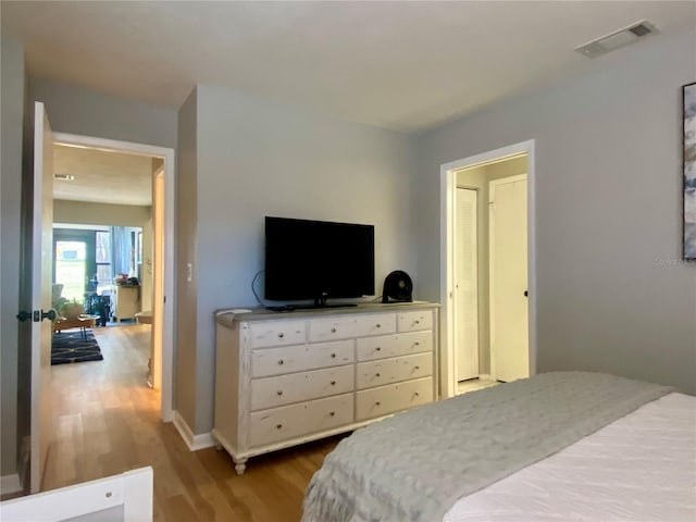 bedroom featuring wood-type flooring