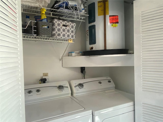 clothes washing area with water heater and washing machine and clothes dryer