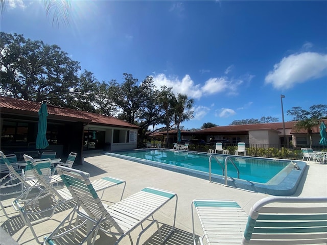 view of pool featuring a patio
