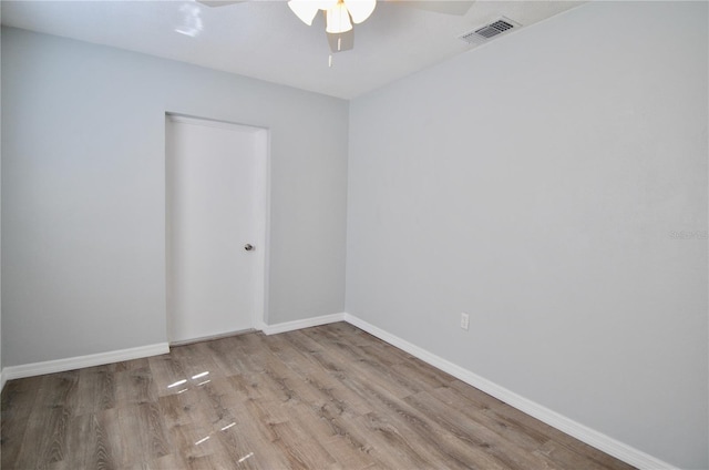 spare room with ceiling fan and light hardwood / wood-style flooring