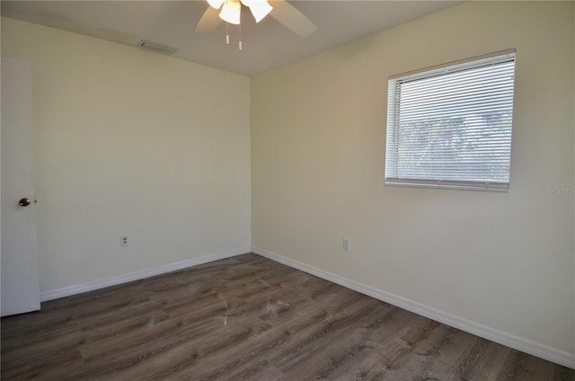 unfurnished room featuring ceiling fan and dark hardwood / wood-style flooring