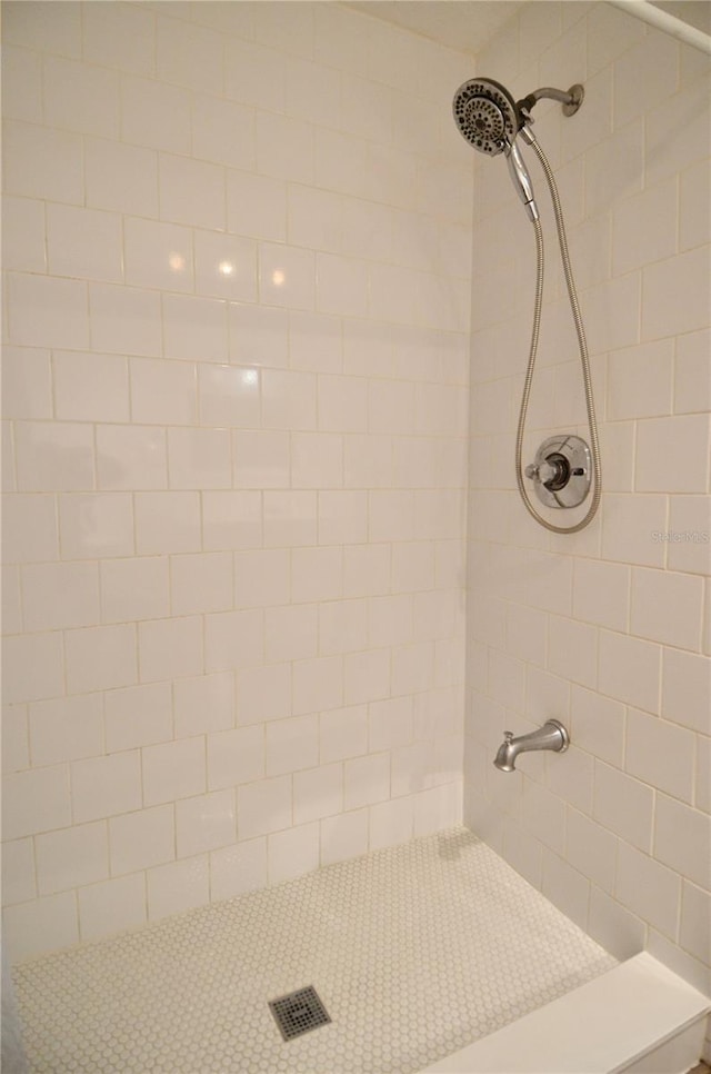 bathroom with tiled shower