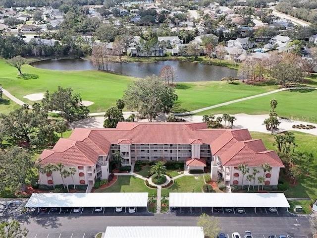 aerial view with a water view and golf course view