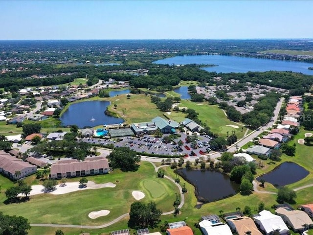 birds eye view of property featuring view of golf course and a water view