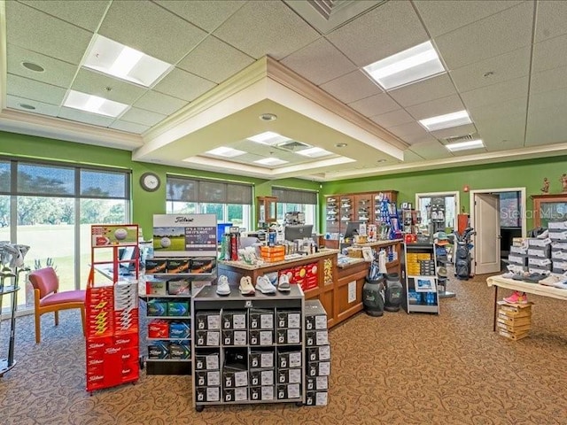 interior space featuring visible vents, crown molding, and a drop ceiling