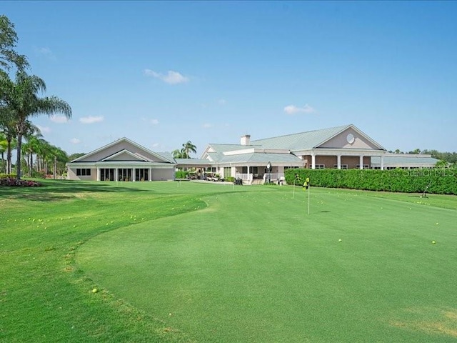 view of property's community featuring a yard