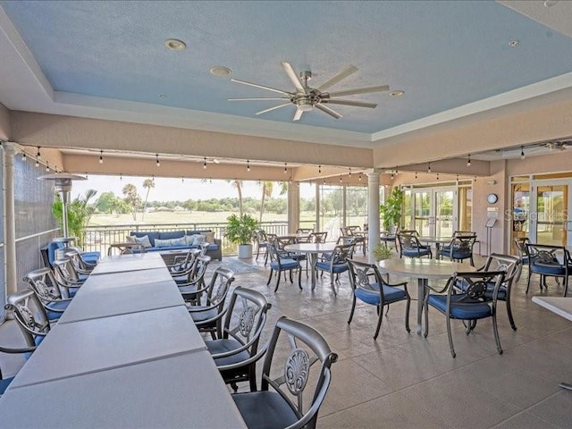 view of patio with ceiling fan and outdoor dining space