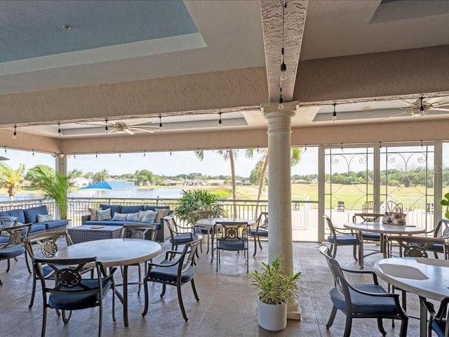 exterior space with outdoor dining space, outdoor lounge area, ceiling fan, and a gazebo