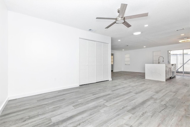 unfurnished living room with visible vents, light wood-style flooring, recessed lighting, baseboards, and ceiling fan