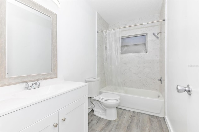 bathroom featuring shower / bath combination with curtain, toilet, vanity, and wood finished floors