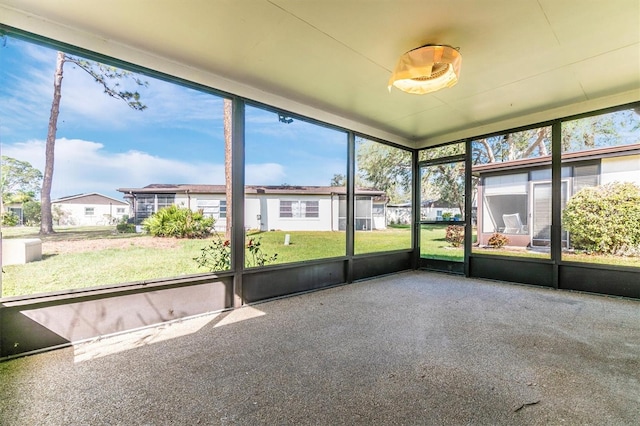 unfurnished sunroom featuring a wealth of natural light