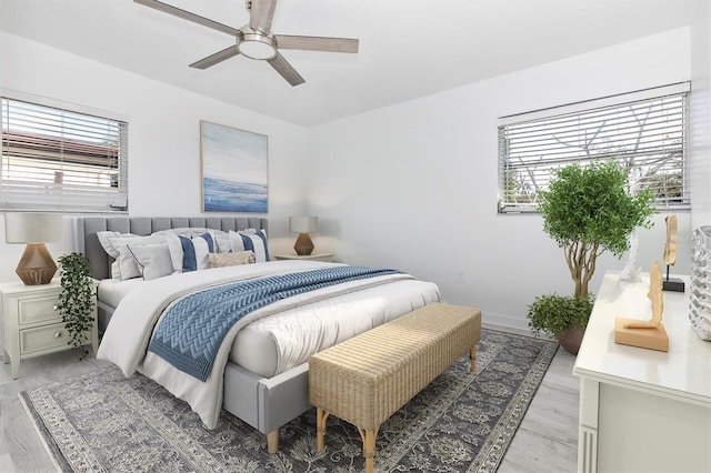 bedroom featuring light wood-type flooring and ceiling fan