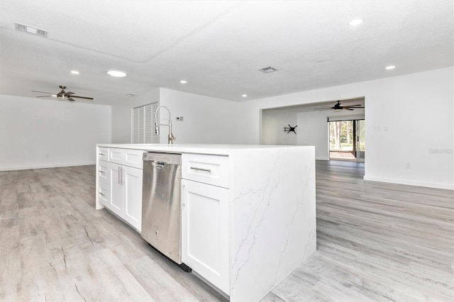 kitchen with visible vents, dishwasher, and open floor plan