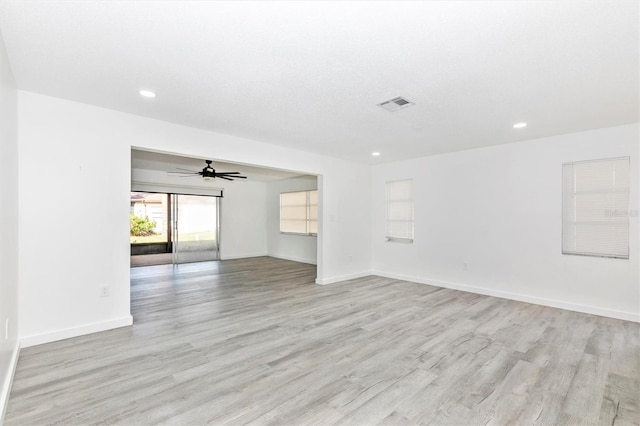 spare room featuring visible vents, recessed lighting, baseboards, and light wood-style floors