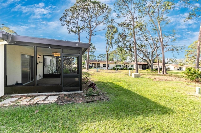 view of yard featuring a sunroom