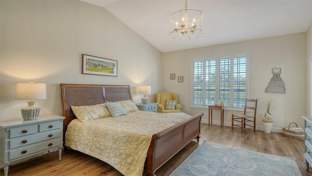 4060 Penshurst Park, Sarasota, FL 34235 - bedroom featuring lofted ceiling, wood finished floors, baseboards, and a notable chandelier