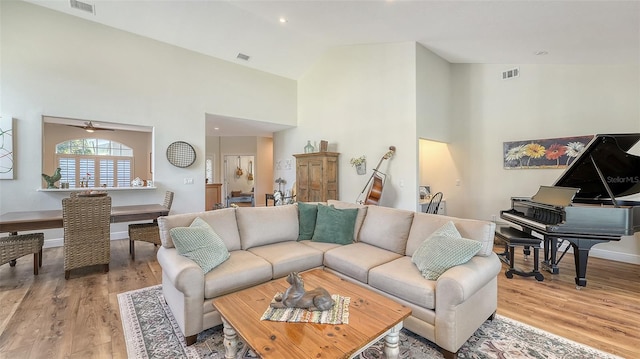 4060 Penshurst Park, Sarasota, FL 34235 - living room featuring baseboards, visible vents, high vaulted ceiling, and light wood-style floors