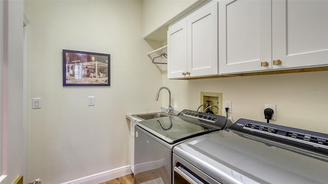 4060 Penshurst Park, Sarasota, FL 34235 - washroom featuring cabinet space, independent washer and dryer, baseboards, and a sink