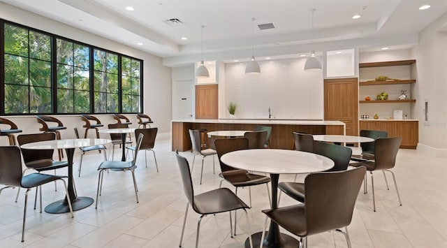 4060 Penshurst Park, Sarasota, FL 34235 - dining space featuring visible vents, baseboards, a raised ceiling, recessed lighting, and light tile patterned flooring