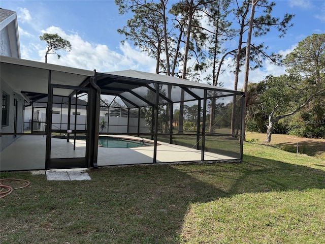 exterior space featuring a pool, a patio area, and a lawn