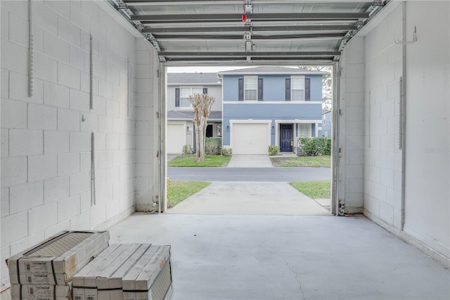 garage with concrete block wall