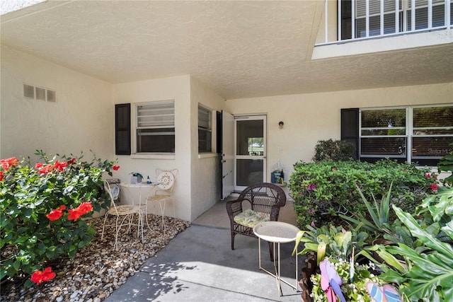 doorway to property featuring a patio area