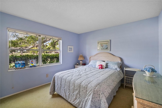 bedroom featuring carpet floors and a textured ceiling