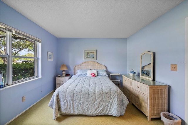 carpeted bedroom with a textured ceiling